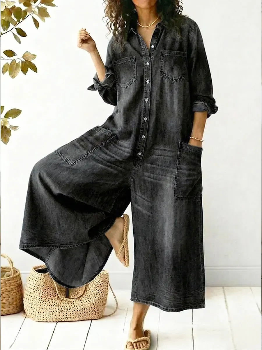 Female model in a black denim wide-leg jumpsuit styled for casual everyday wear.