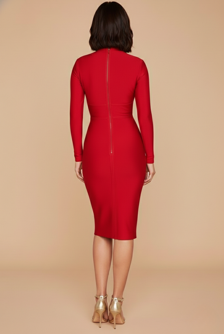 Model in a fitted long sleeve midi dress with a crossover neckline and centre back zip on a plain background.