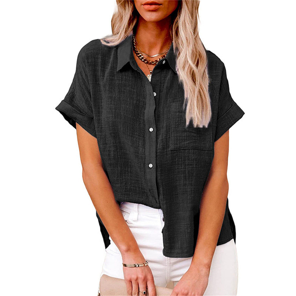 Woman wearing a lightweight relaxed-fit shirt against a plain background.