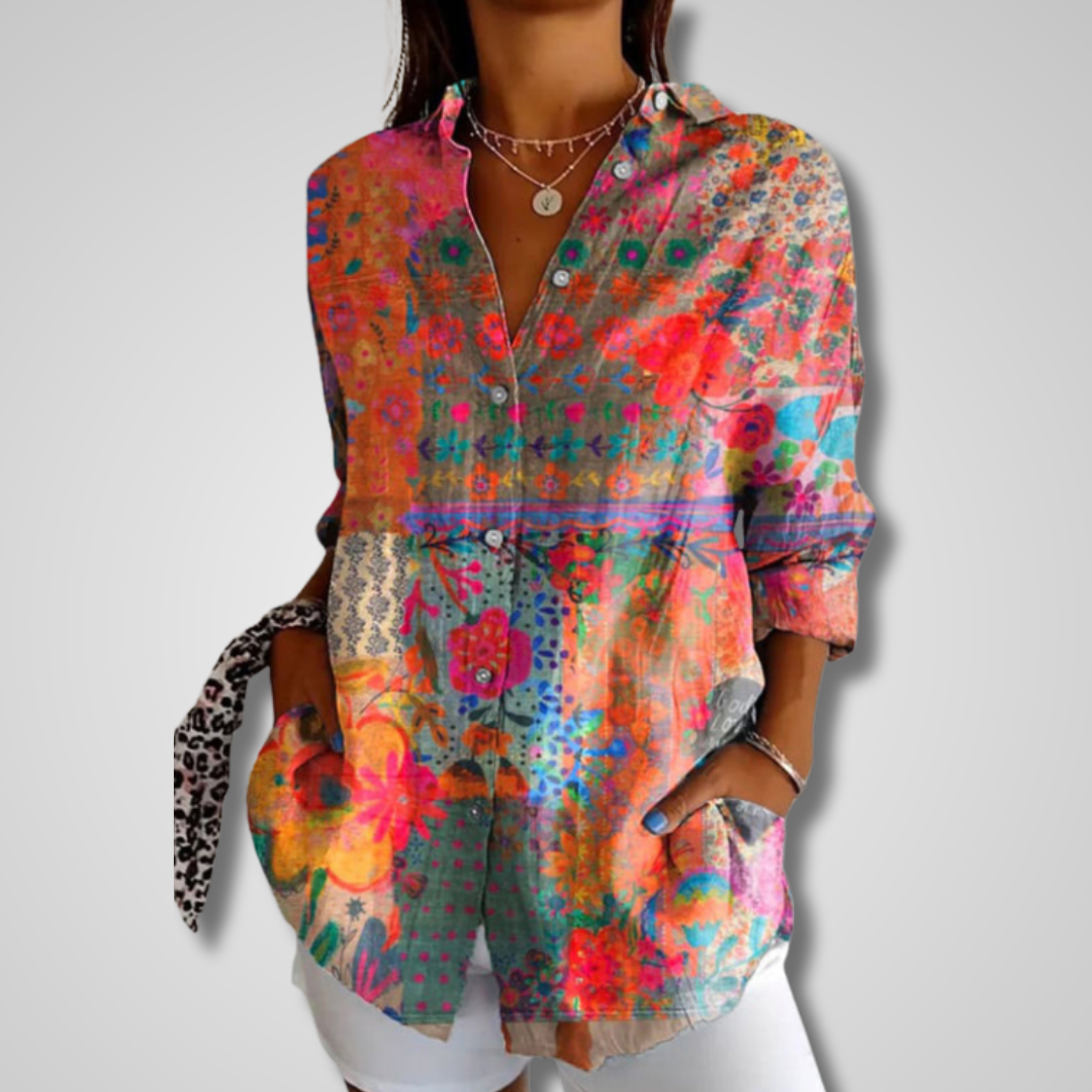 Women’s vintage-inspired relaxed shirt w/ model on a plain background.