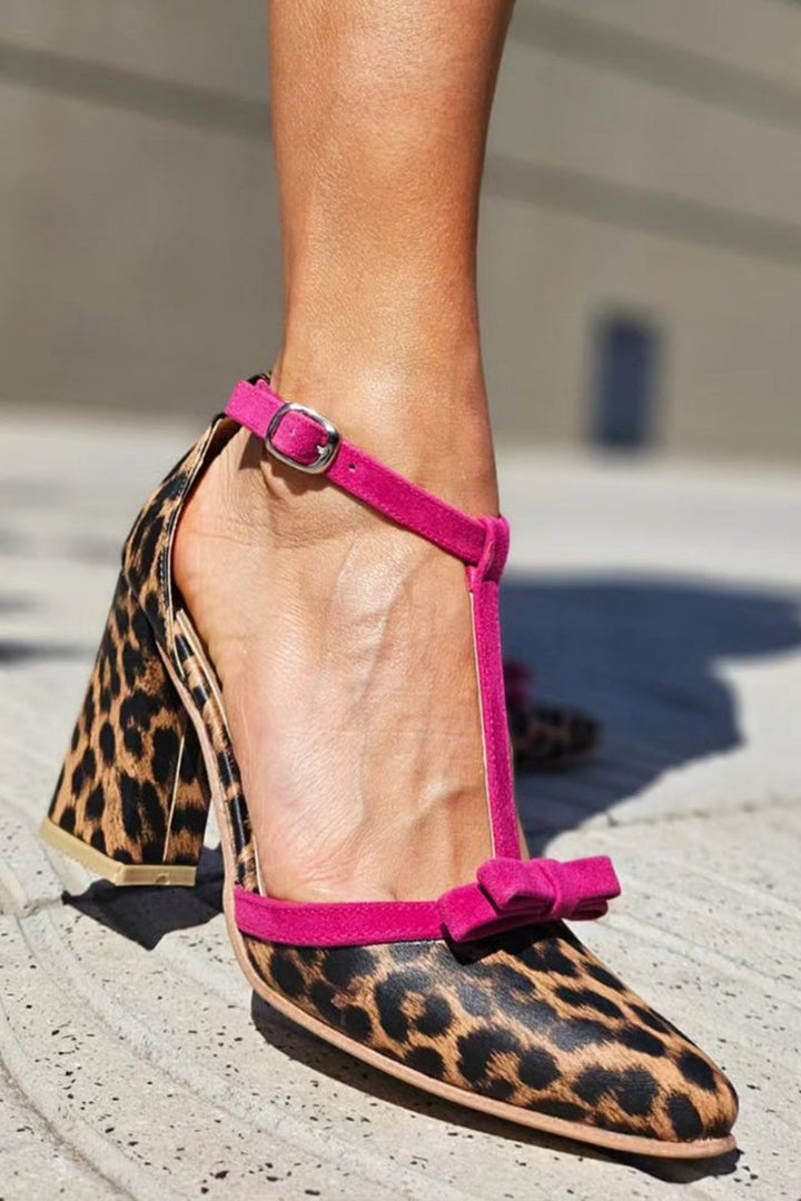 Leopard print stiletto sandal with colorful accents on a clean background