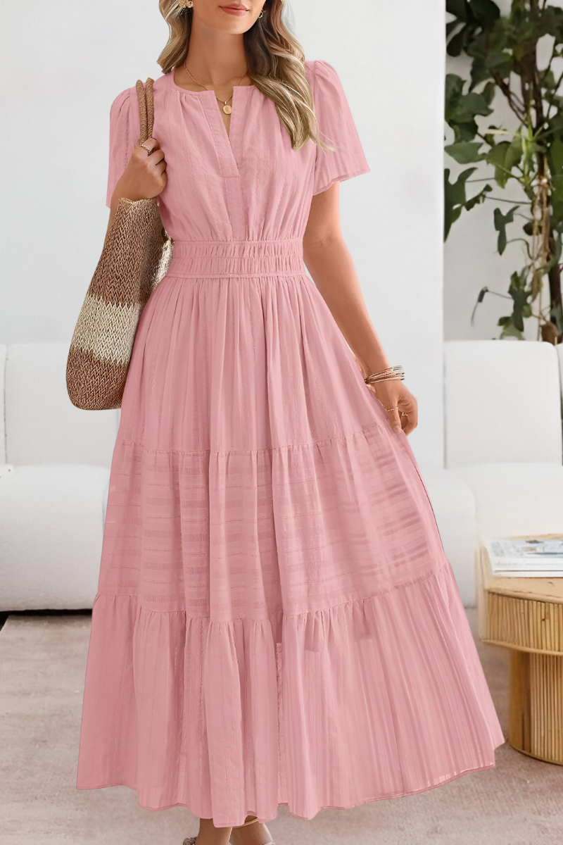 Lightweight maxi dress with flattering silhouette displayed on a plain background.