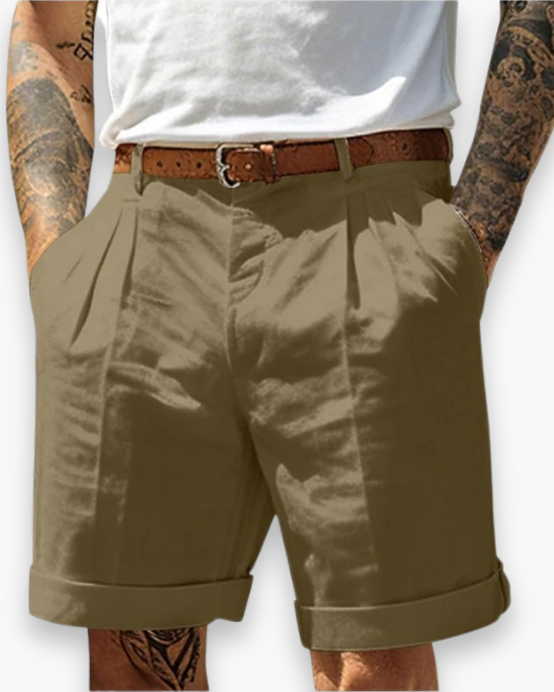Model featuring cuffed casual shorts with a clean tailored silhouette on a plain background.