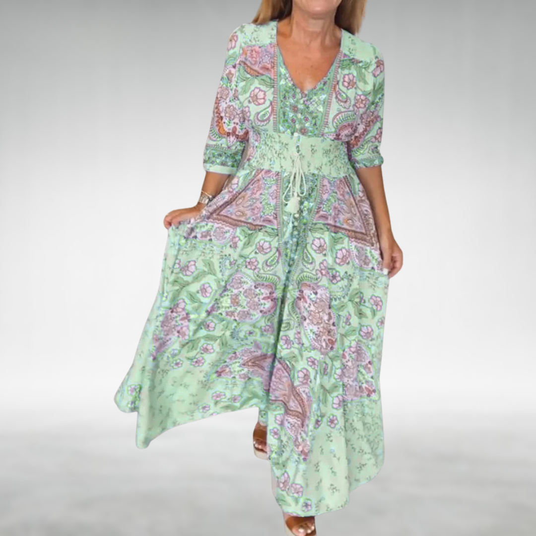 Women’s boho maxi dress with gathered waist and airy relaxed shape.