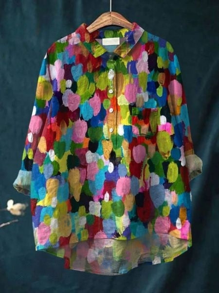Elegant women’s floral top with a plain background.