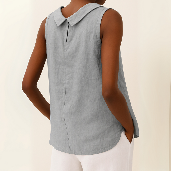 Women’s modest sleeveless top with smooth draping shown on a person against a plain background, back view