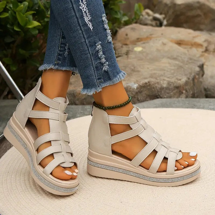 Female wearing cushioned comfort sandals designed for everyday walking.