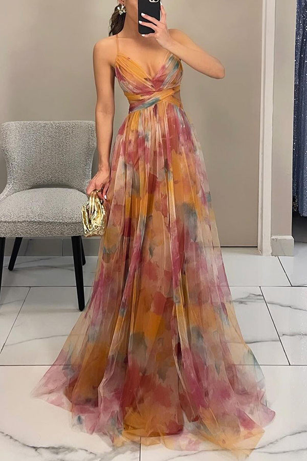 Woman posing in a polished maxi dress on a clean background.