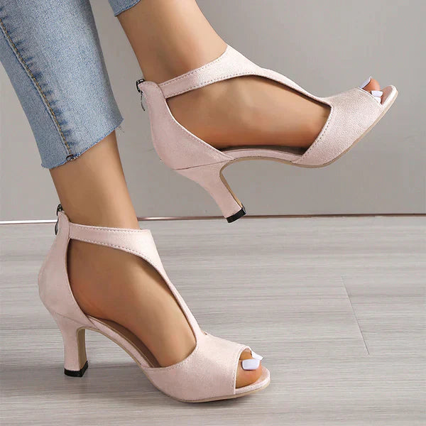 Women’s supportive heeled sandals with soft straps and open toe design.