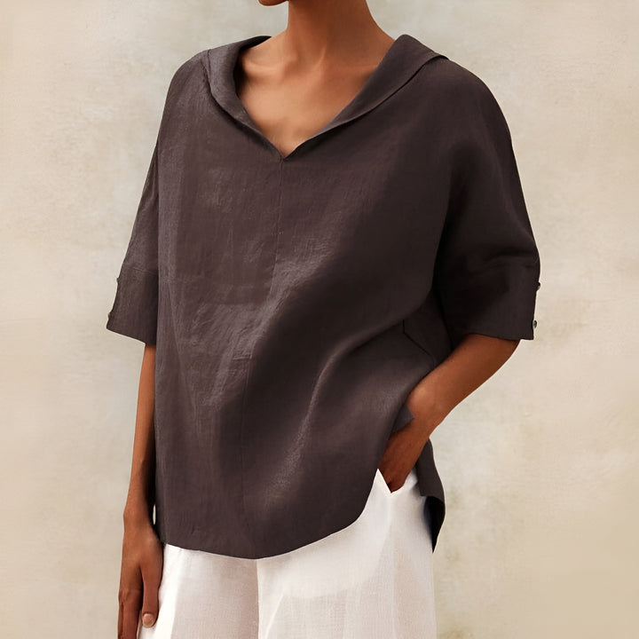 Lightweight women’s blouse shown on a clean background with a flattering loose fit and refined details.