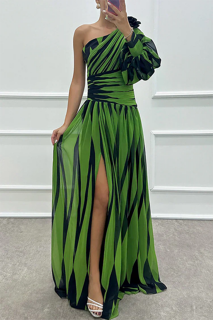 Female model styled in a flowing one-shoulder dress on a clean background.