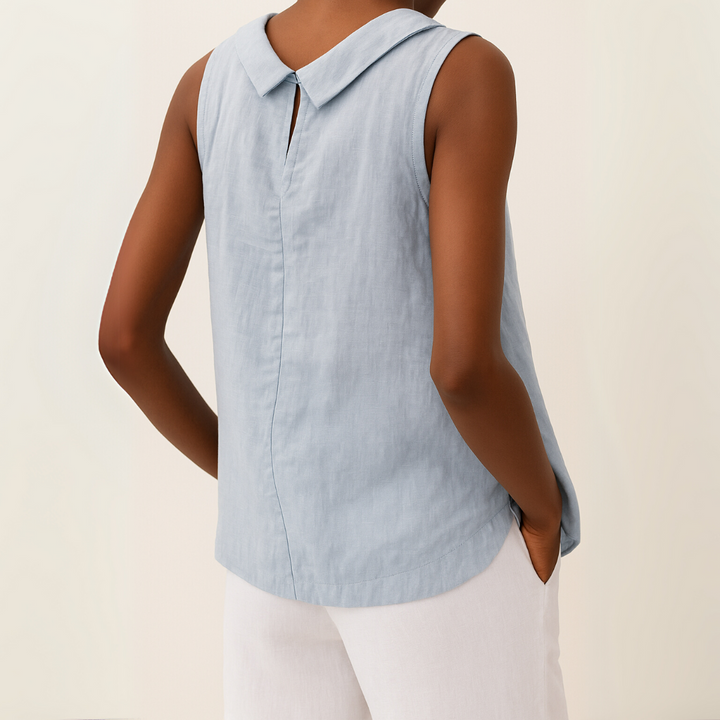 Refined sleeveless roll neck top displayed on a person with a clean background.