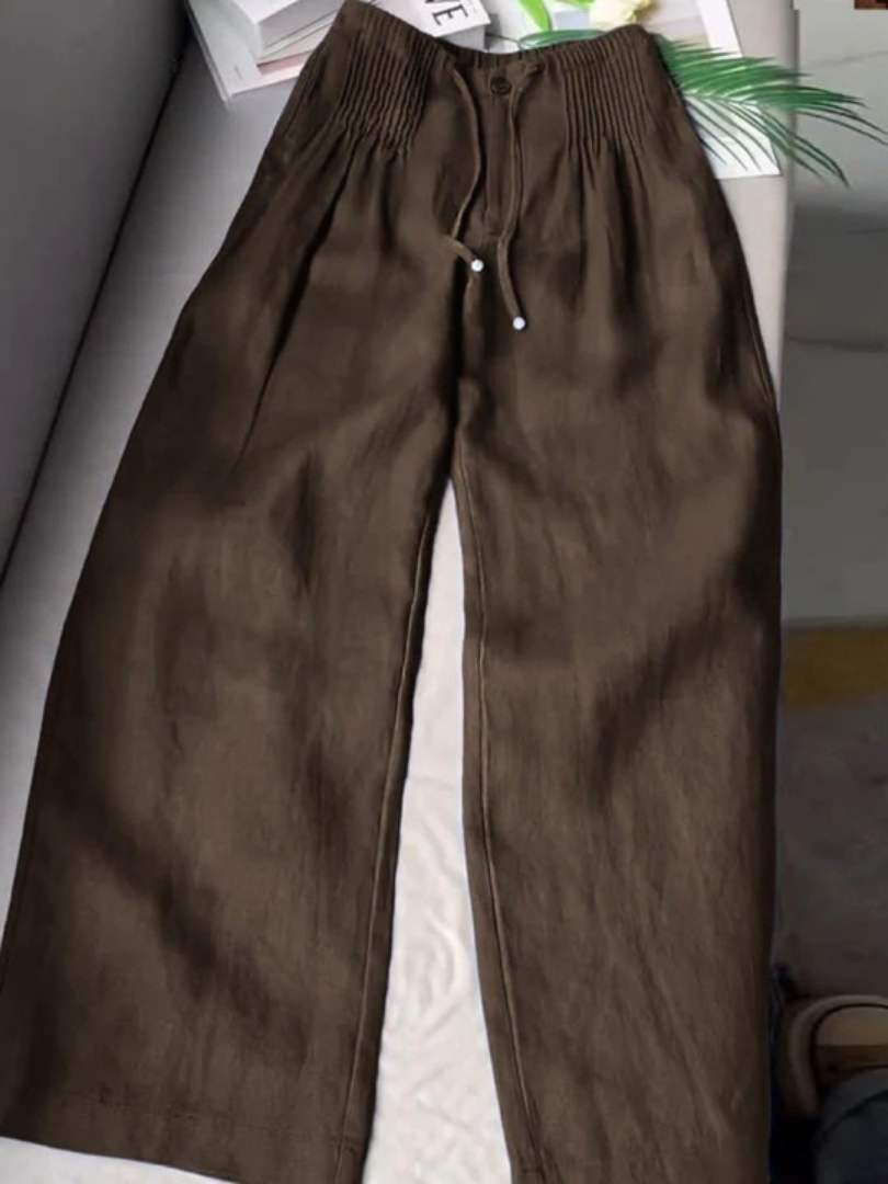 Wide-leg pants displayed with a smooth waist and airy leg design.