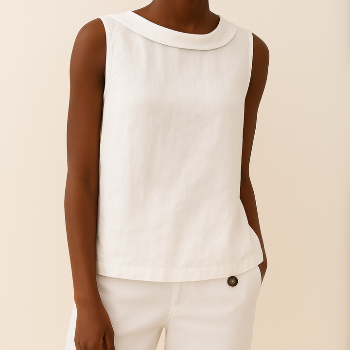 Sophisticated sleeveless top with soft roll collar worn by a person against a clean background.
