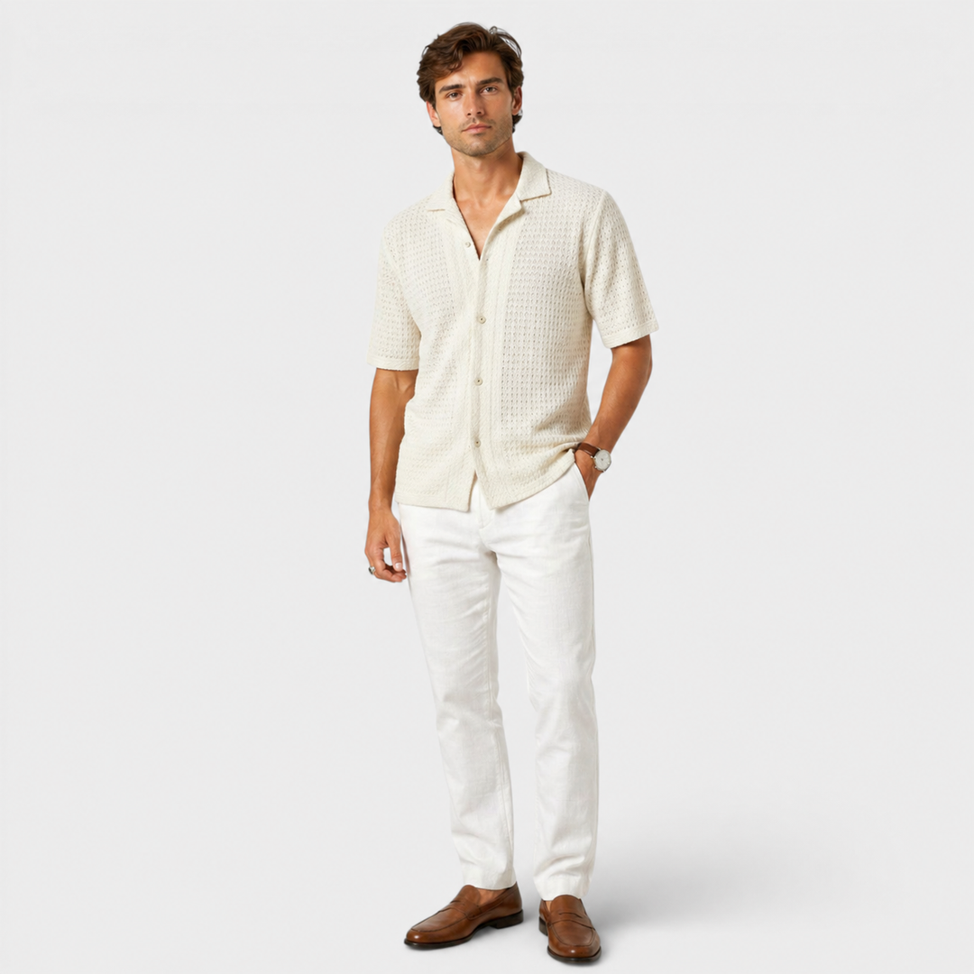  Male model wearing a lightweight knit shirt for warm-weather dressing.