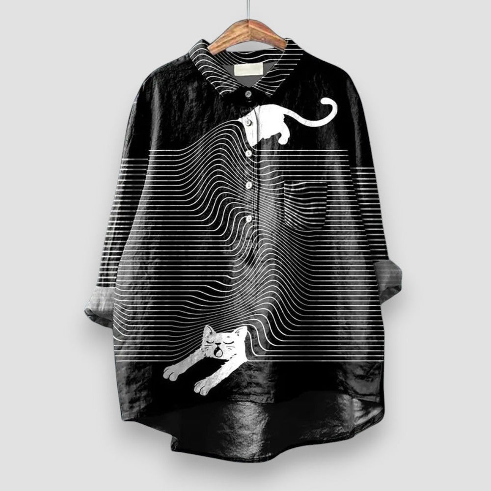 Playful women’s animal print blouse shown on a plain background with soft draped styling.