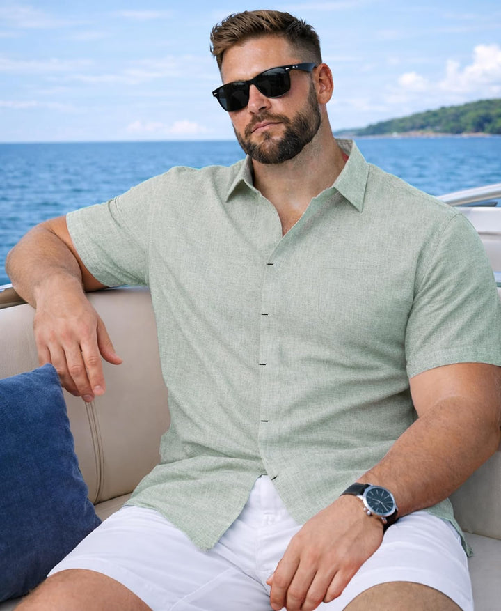  Male model wearing a modern short sleeve shirt with a relaxed fit on a plain background.