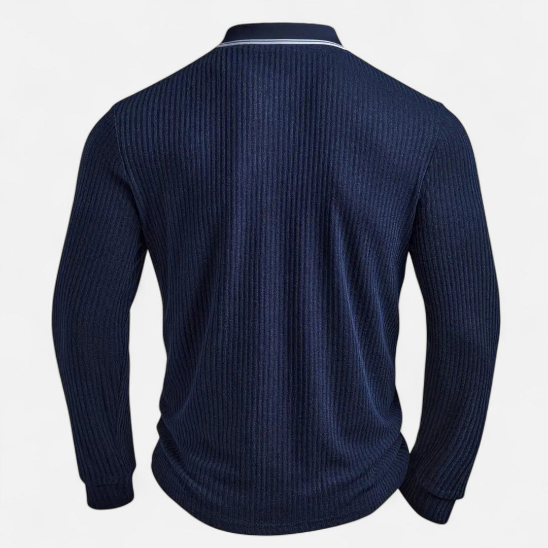  Male model wearing a navy smart-casual shirt with white detailing on a plain background.