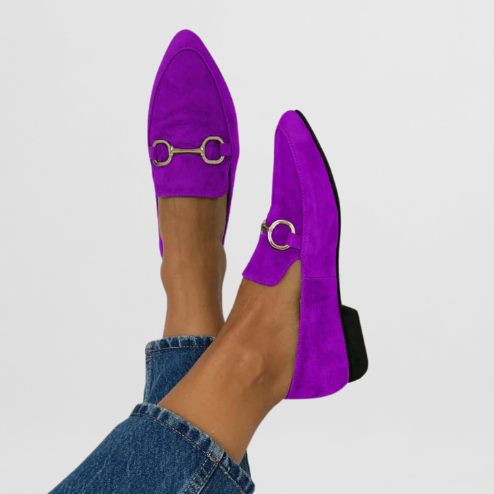 Bright patterned women’s moccasins displayed on a clean plain background.