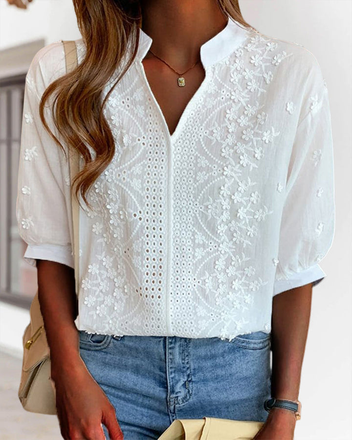 Front product image highlighting lace accents and puff sleeves.