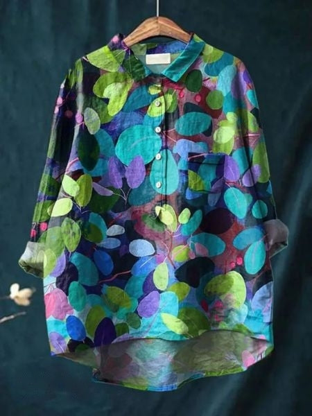 Flowing floral blouse on a plain background.