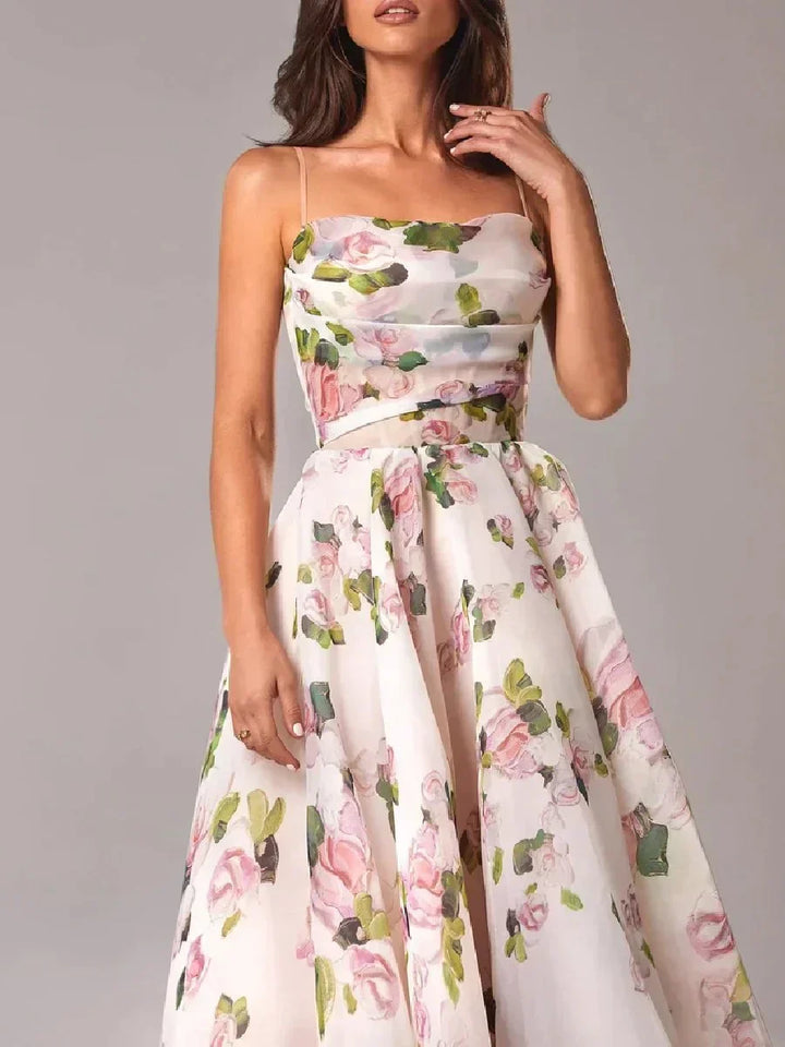 Female model displaying a strapless floral dress