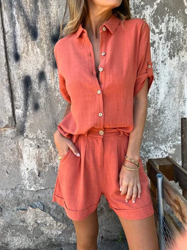 Woman styled in a relaxed shorts and top set on a plain studio background.