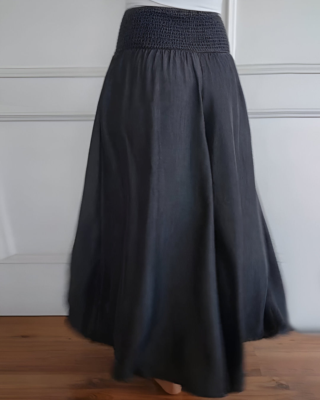 Stylish stretch trousers for women on plain background.