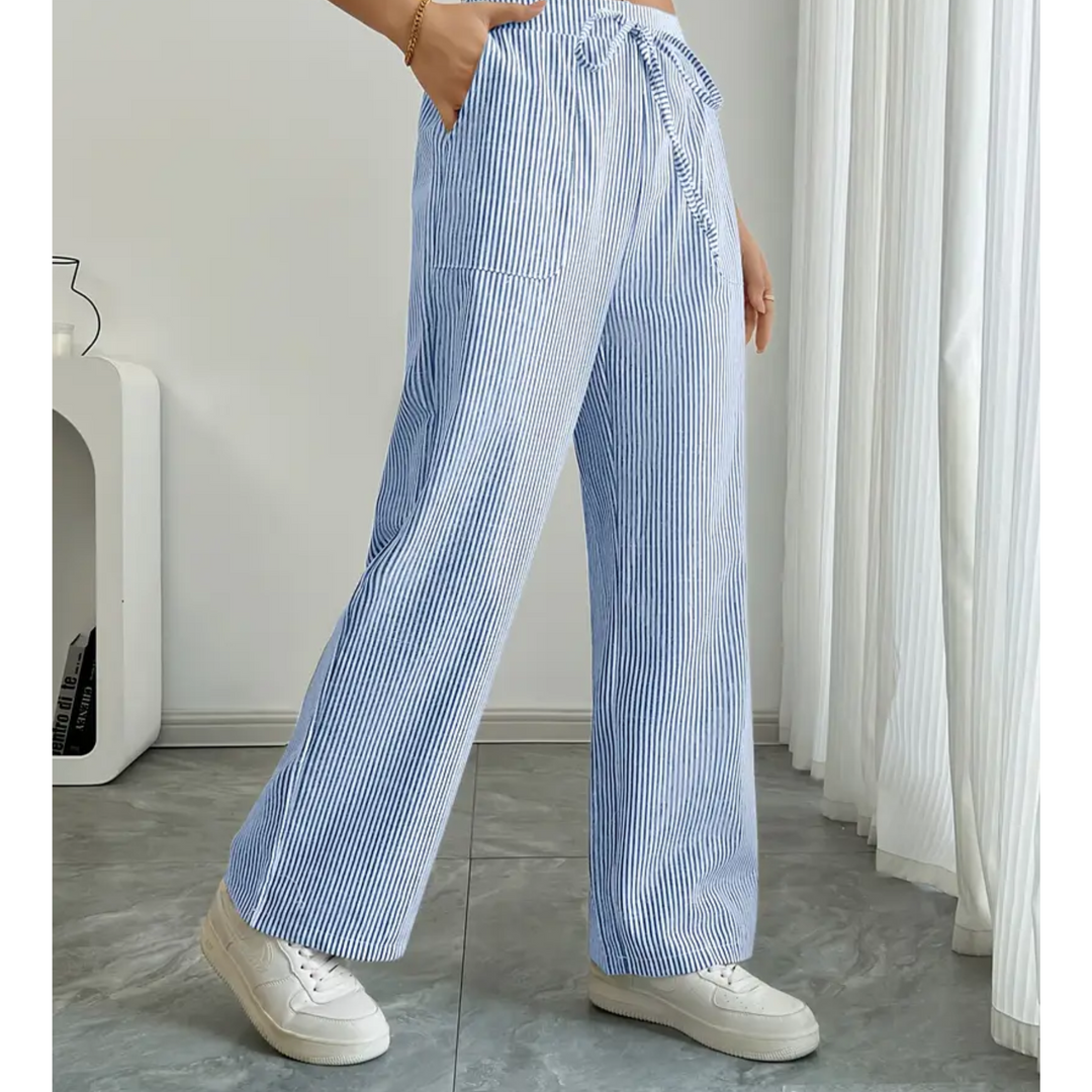 Wide-leg striped trousers with practical pockets on a plain background.