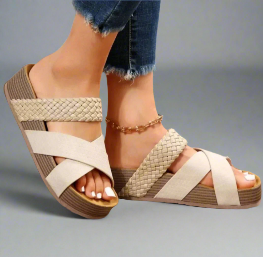 Close-up of sandal on foot with ergonomic sole.