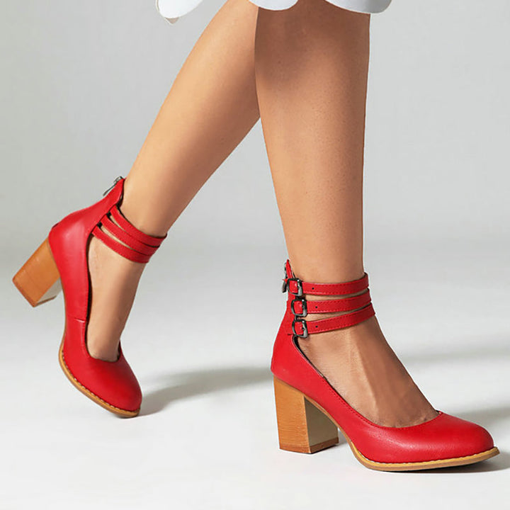 Minimalist women’s sandal with block heel displayed on a plain background.