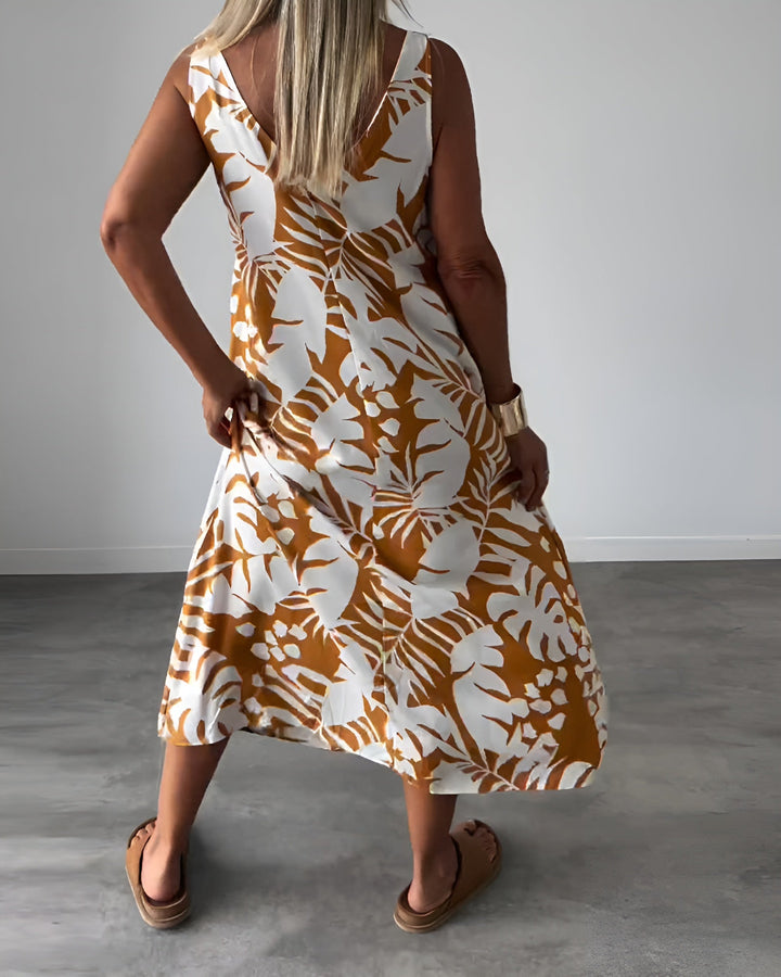 Flattering maxi dress designed with an open neckline and smooth flowing, back angle view 