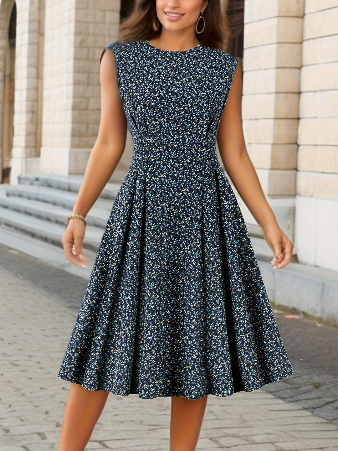 Female model wearing a sleeveless floral midi dress against a plain background.