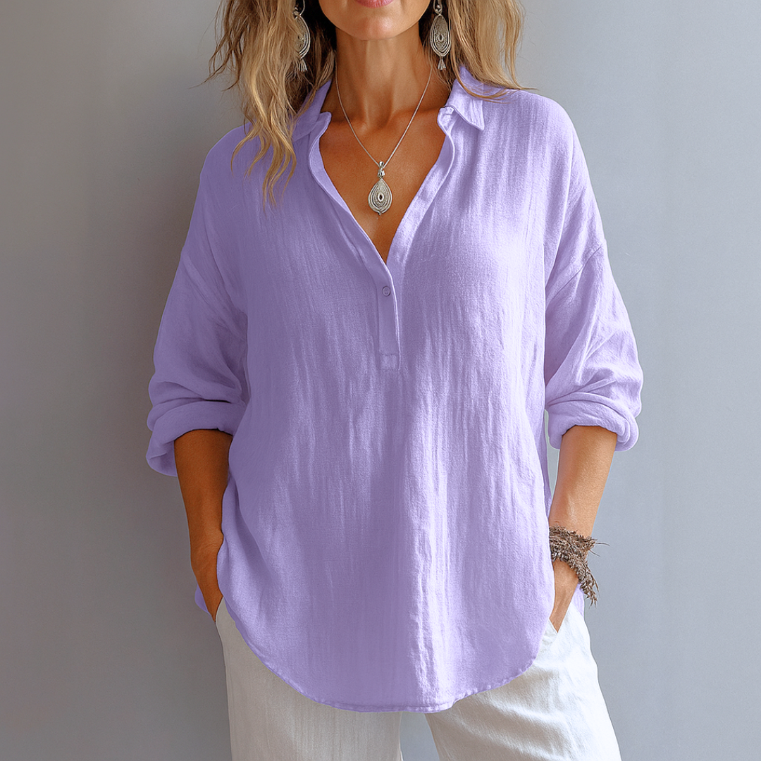 Chic blouse with refined neckline details displayed on plain background