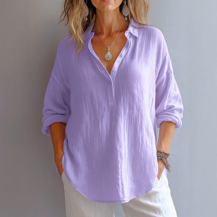 Chic blouse with refined neckline details displayed on plain background