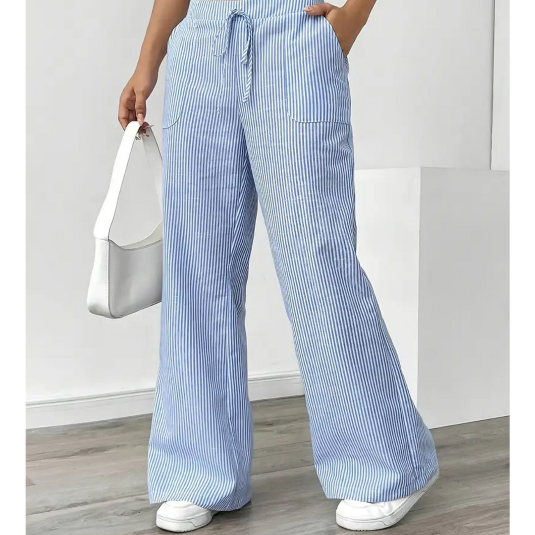 Vertical striped pants for women with pockets on a simple background.