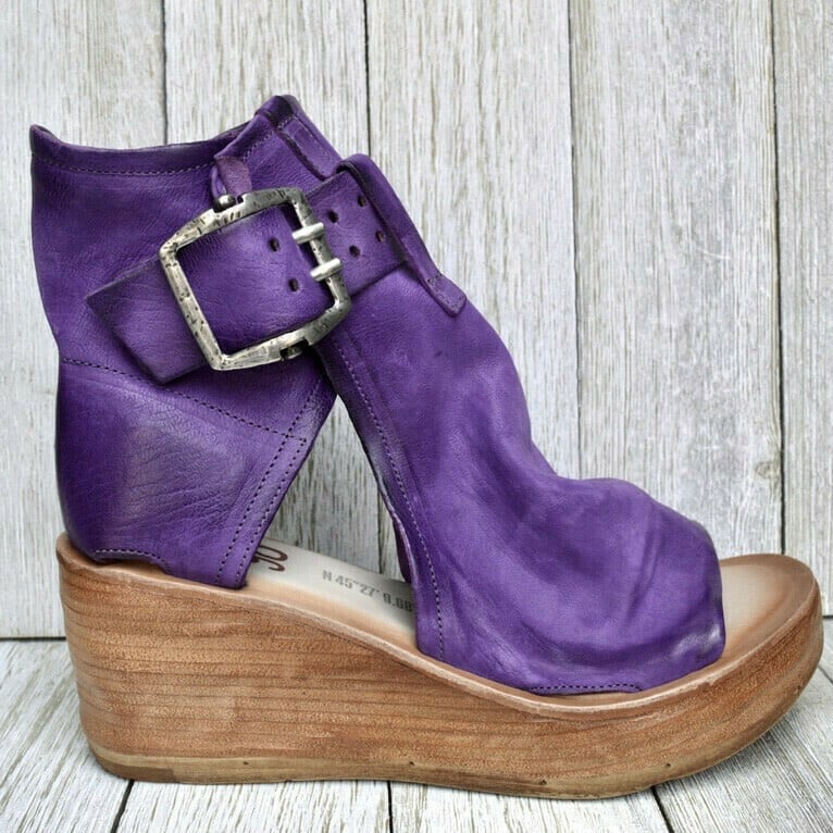 Casual wedge sandals featuring open-toe styling and supportive footbed on a clean background.