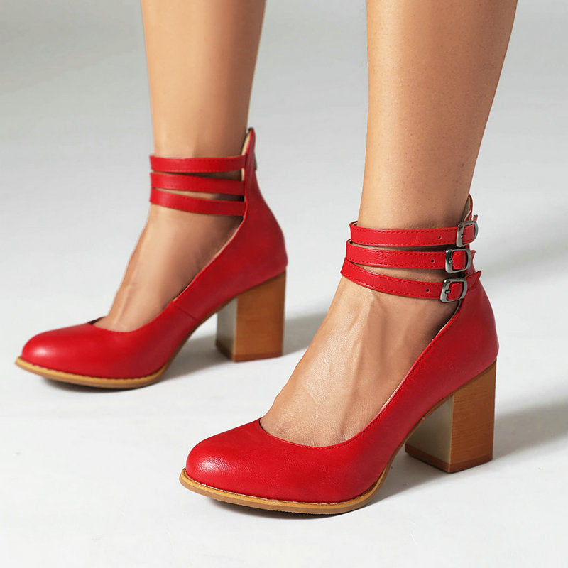 Foot in a simple block heel sandal with secure ankle closure.
