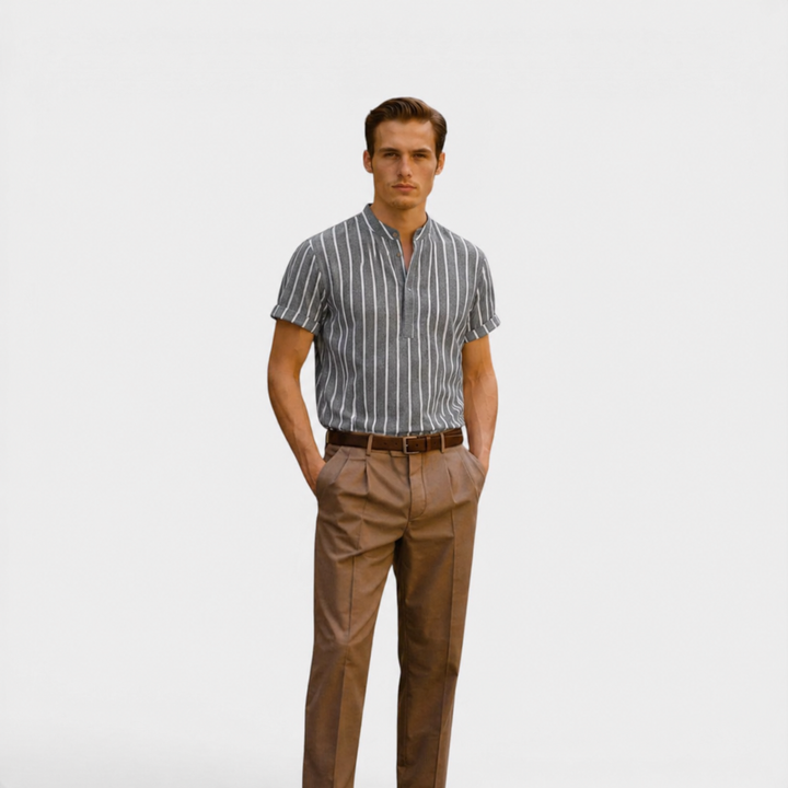  Male model presenting a lightweight summer polo shirt on a plain background.