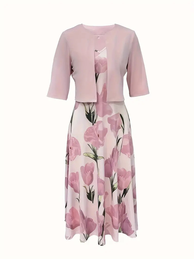 Woman styled in a flowing floral maxi dress set with a coordinating jacket.