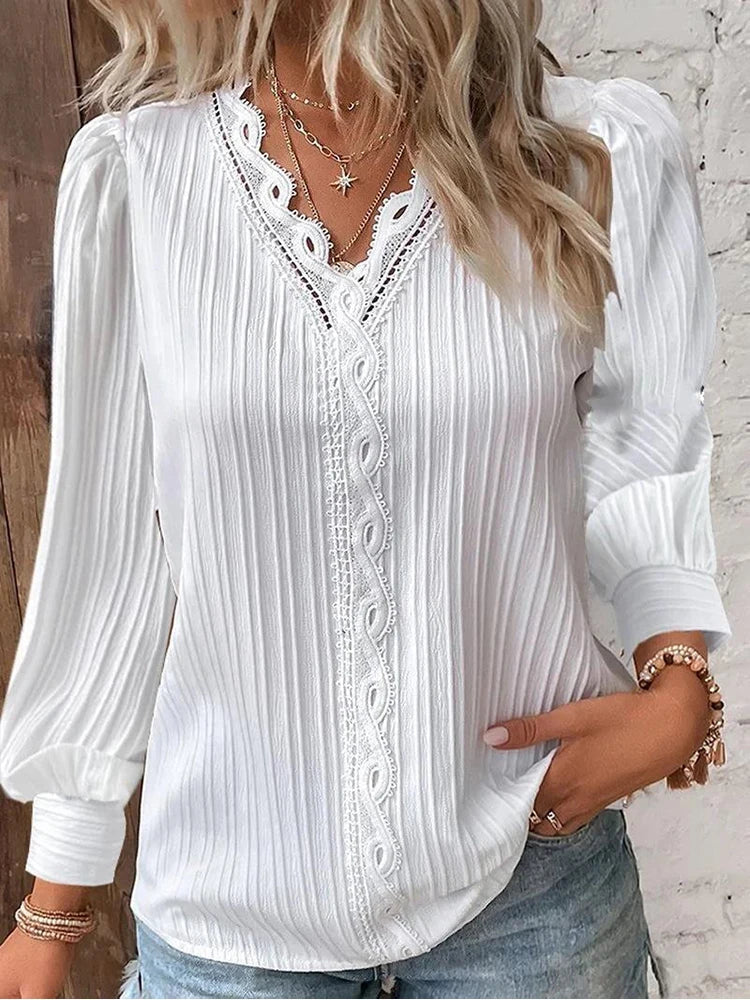 Elegant chiffon lace blouse worn by a person against a plain background.