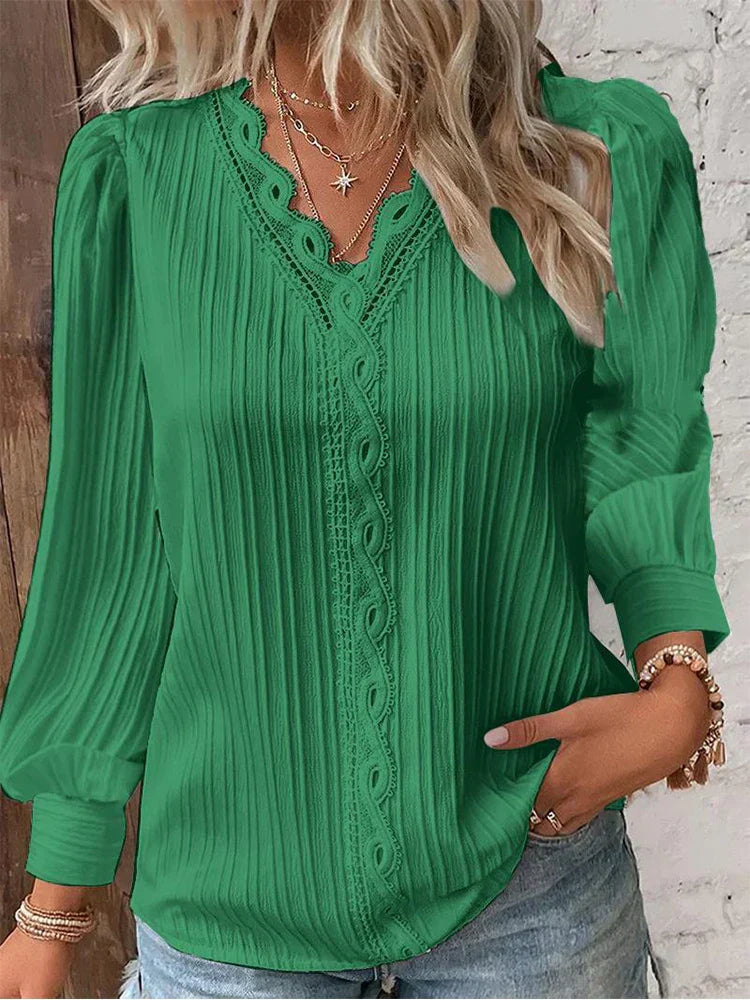 Lightweight chiffon blouse with delicate lace detail worn in a simple studio setting.