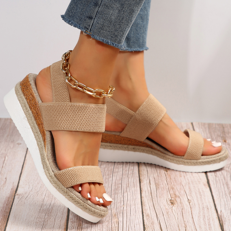 Cushioned sandals on a plain background with adjustable straps and a supportive footbed.