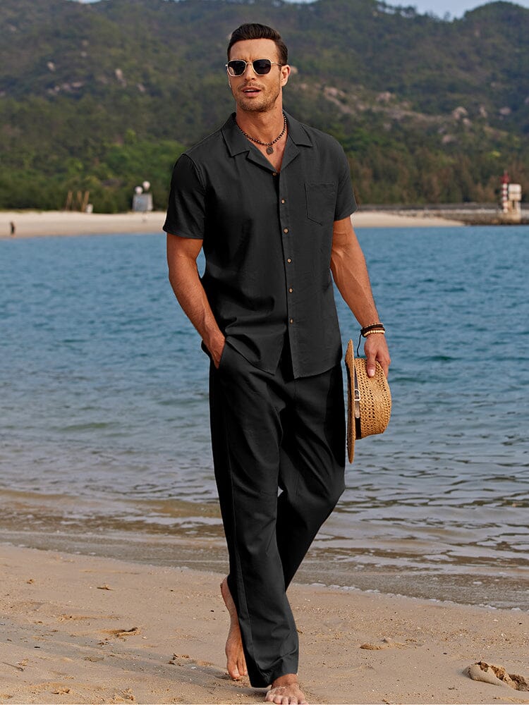 Man in a lightweight matching shirt and pants ensemble on a plain background.