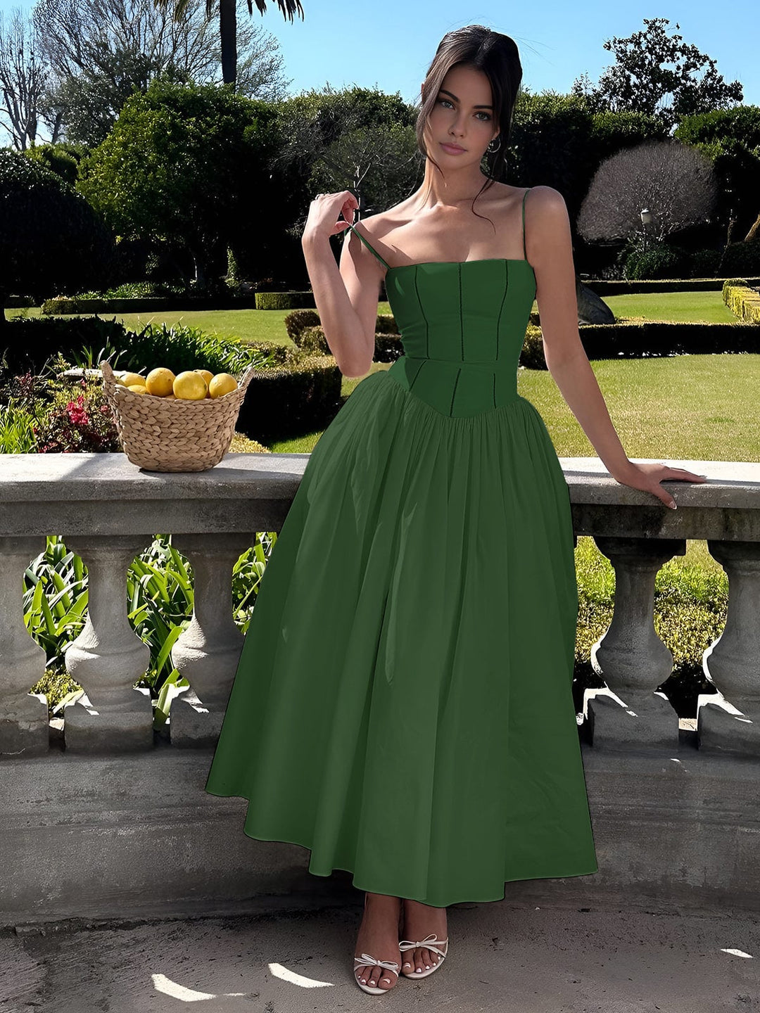 Woman showing front view of elegant midi dress outdoors.