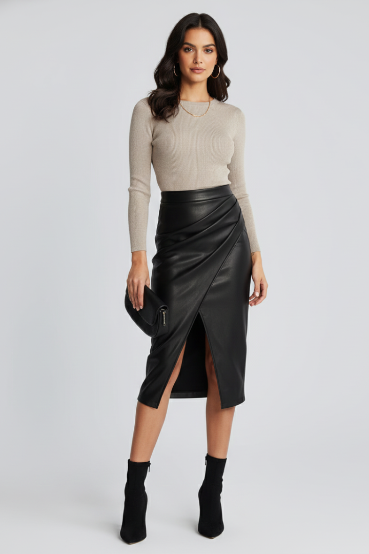 Model wearing polished pleated skirt, gray backdrop
