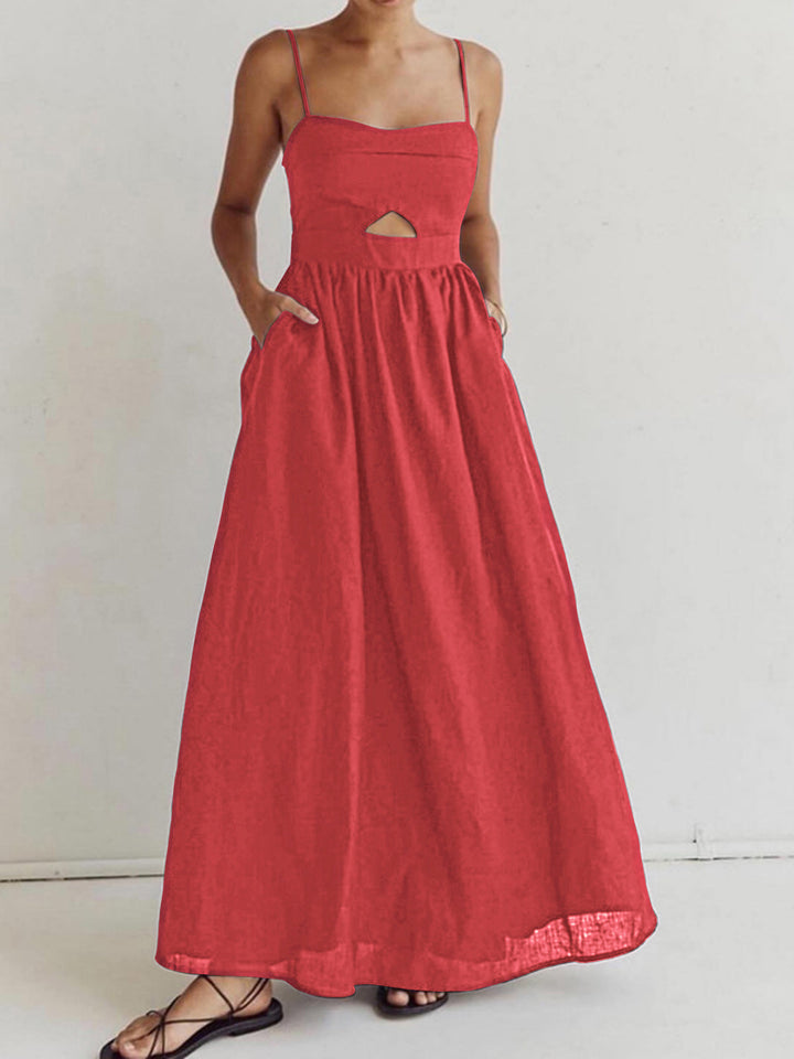 Woman wearing a lightweight maxi dress with a sleeveless design against a plain background.
