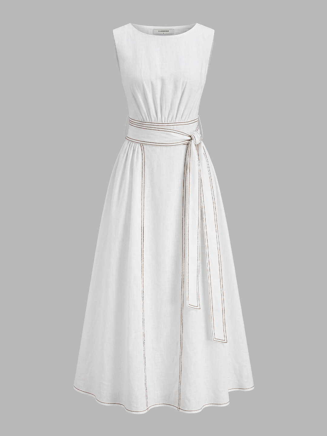 Female model in a belted sleeveless midi dress showing a clean everyday look on a plain background.