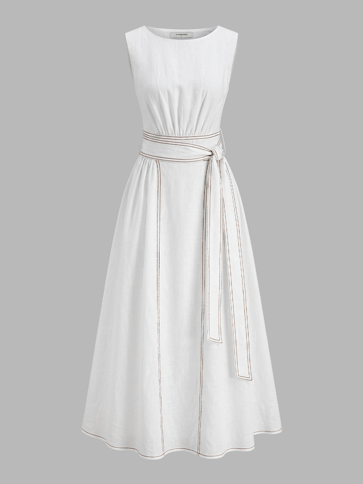 Female model in a belted sleeveless midi dress showing a clean everyday look on a plain background.