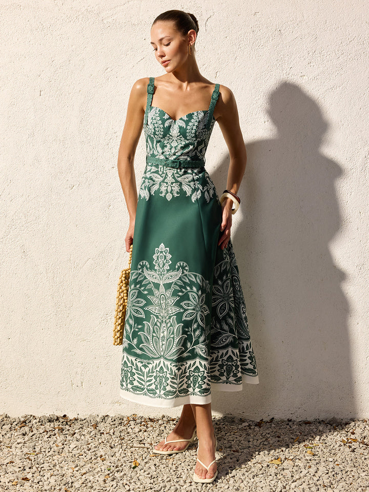 Female model wearing a square neck sleeveless maxi dress against a plain background.